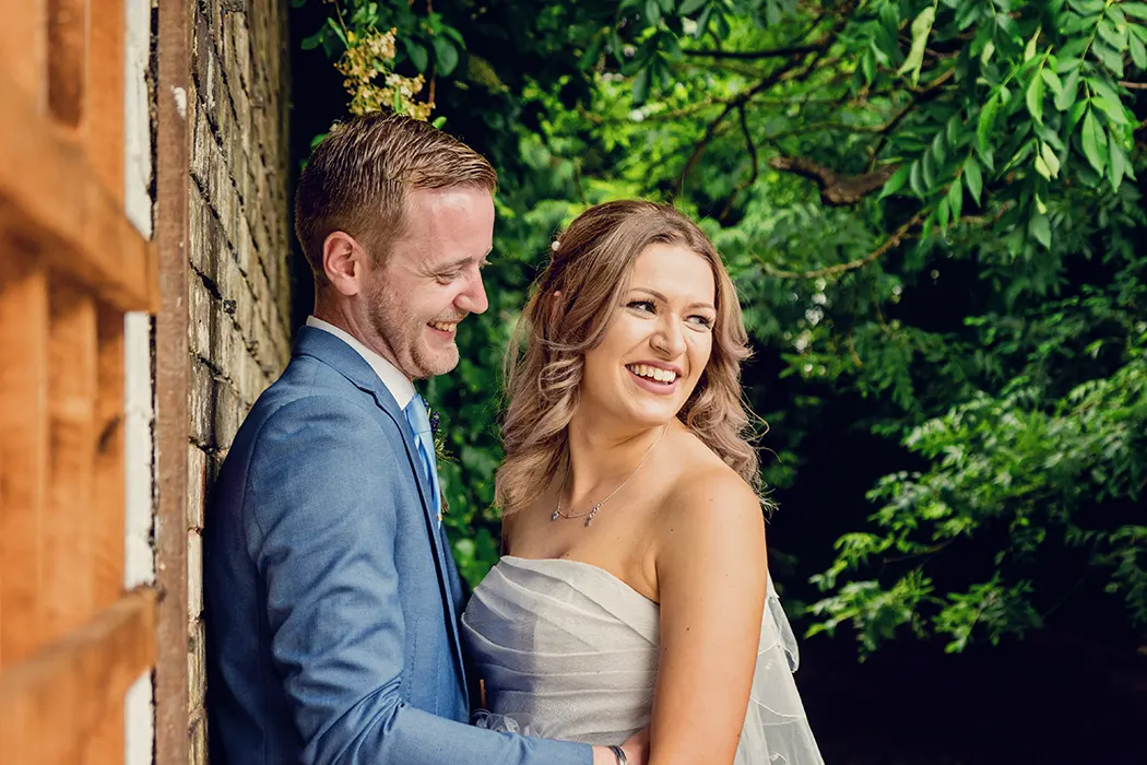 Bride and groom lauging outside St. Andrews Hotel Bride and groom lauging outside St. Andrews Hotel
