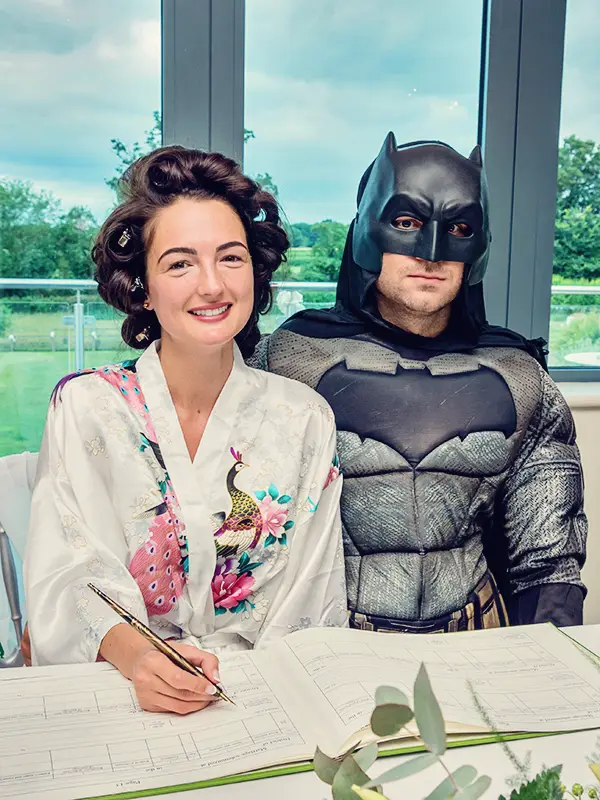 Groom dressed as Batman during a civil ceremony