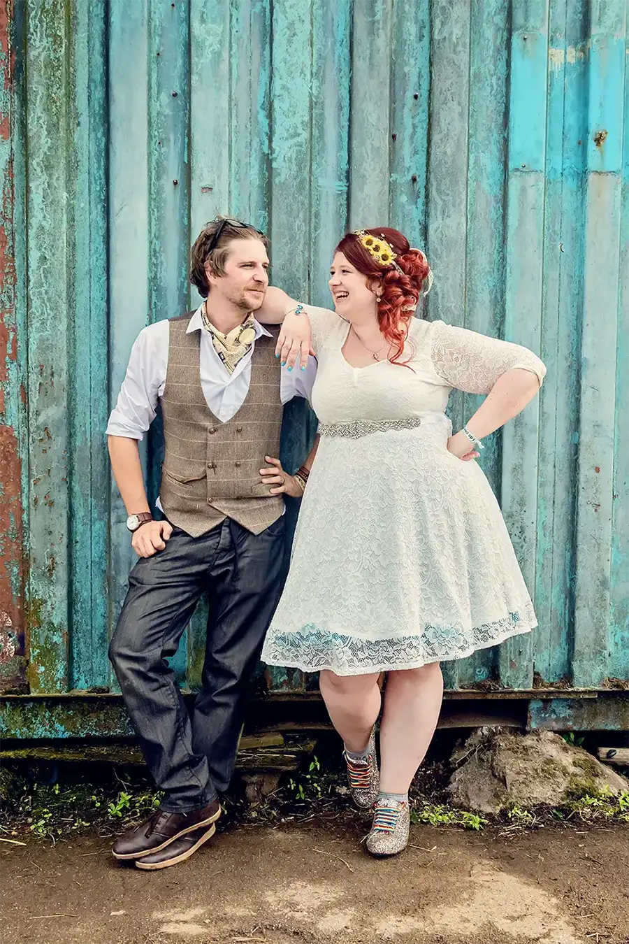 Bride and groom chilling outside a barn door in Worcester