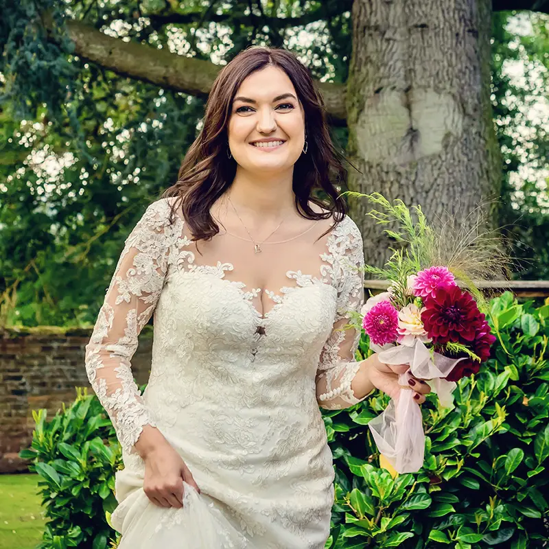 Bride holding vibrant bouquet at Worcestershire summer wedding